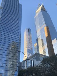 Low angle view of modern buildings against sky