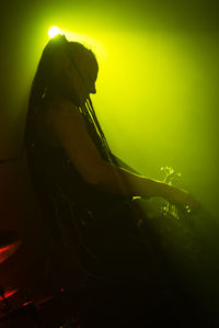 Young woman in music concert