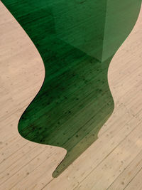 High angle view of leaf on wooden table