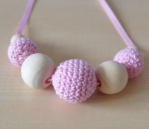 Close-up of pink and white hand crafts on table