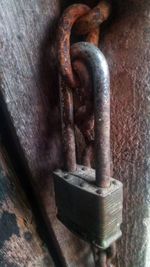 Close-up of padlock on metal door