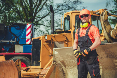 Portrait of man working on sunglasses