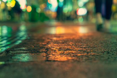 Surface level of wet street at night