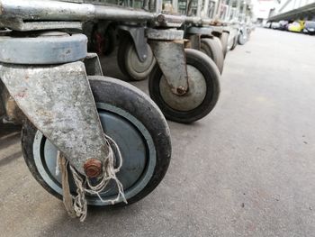 Close-up of motorcycle on street in city