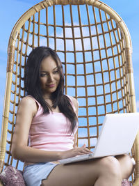 Close-up of young woman using mobile phone