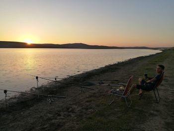 Scenic view of sea against clear sky during sunset