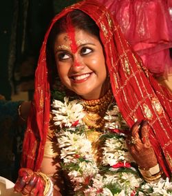 Smiling bride looking away during wedding