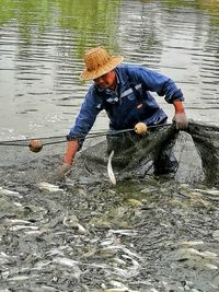 Man fishing in lake