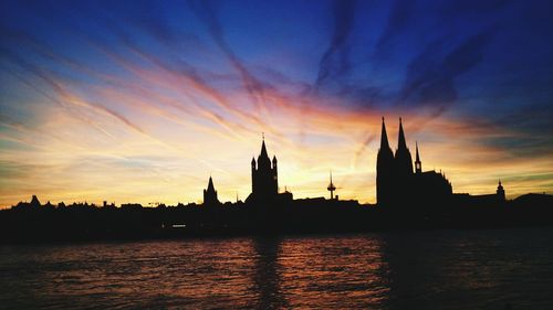 Silhouette of buildings at waterfront