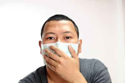 Portrait of man against white background