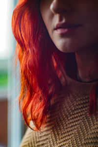 Close-up of young woman with redhead