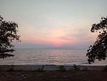 Scenic view of sea against sky during sunset