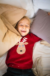 Portrait of cute baby girl sleeping on bed