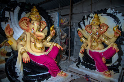 Low angle view of statue against building