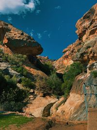 Scenic view of mountains against blue sky