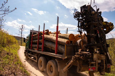 Abandoned truck on field against sky