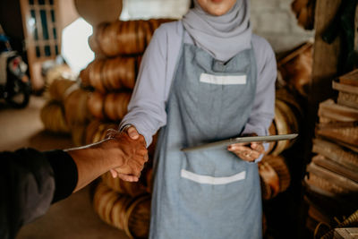 Side view of woman using mobile phone