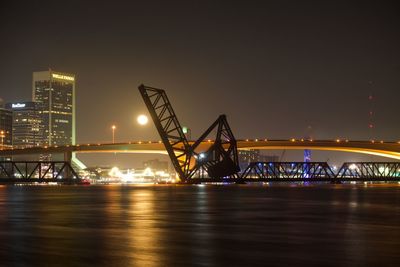 Illuminated suspension bridge at night