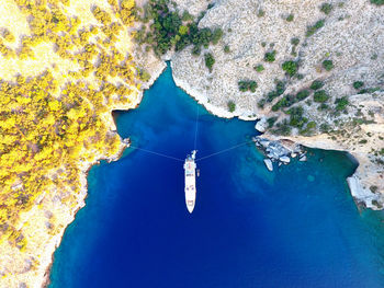 High angle view of sea against sky with yatch 