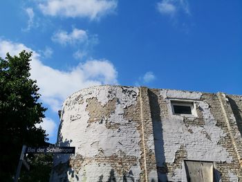 Low angle view of old building against sky