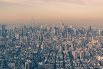 High angle view of city buildings during sunset