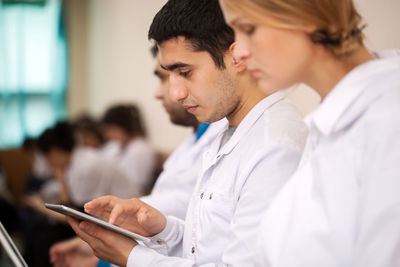 University students using technologies during conference