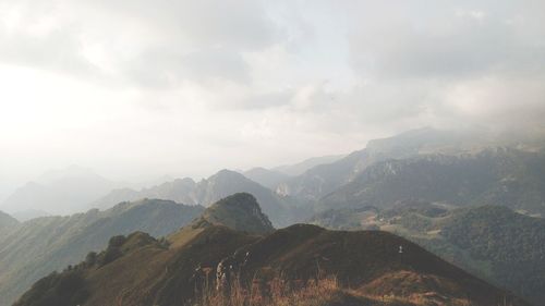 View of mountain range against cloudy sky