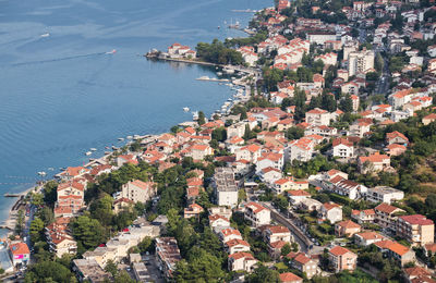 High angle view of townscape by sea