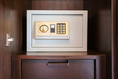 Close-up of telephone booth on table at home