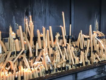 Panoramic view of candles in building