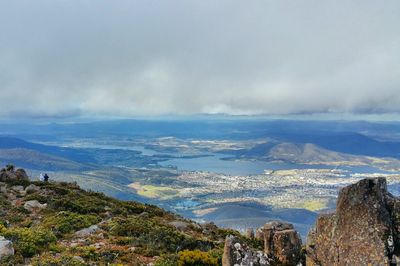 Panoramic view of sea and cityscape against sky