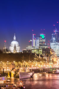 Illuminated buildings at waterfront