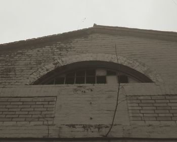 Low angle view of old building against sky