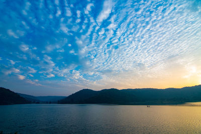 Scenic view of lake against sky during sunset