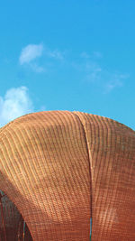 Low angle view of parasol against sky