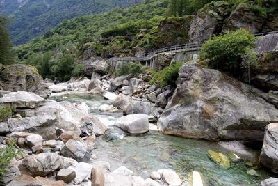 Scenic view of river by mountains