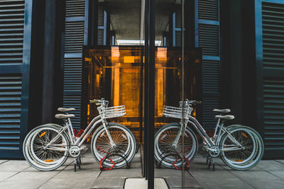 Bicycles parked on street against building