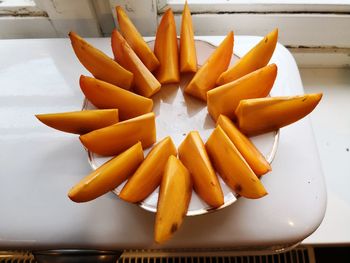 High angle view of orange slices in plate on table