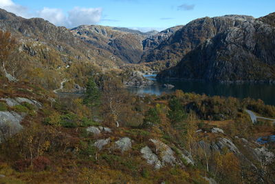 Scenic view of lake and mountains against sky