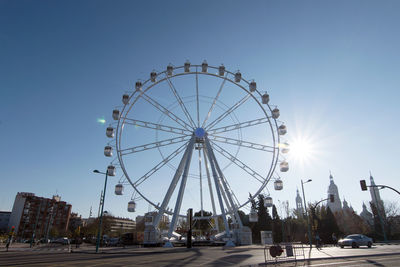 Ferris wheel against sky in city