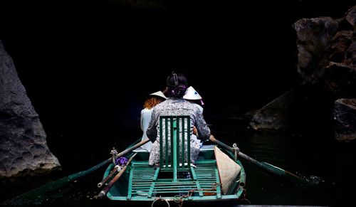 Rear view of woman on boat