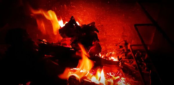 Close-up of bonfire on fire at night