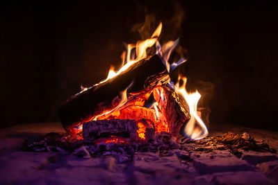 Close-up of fire burning at night