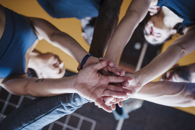 High angle view of couple hands