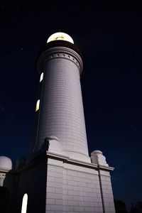 Low angle view of lighthouse at night