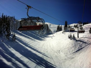 Overhead cable car against sky during winter