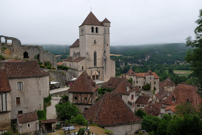 Buildings in city against sky