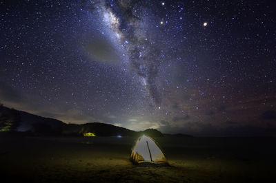 Scenic view of star field against sky at night