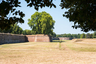 Built structure on field against clear sky