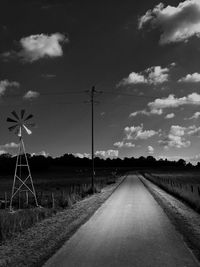 Country road passing through field